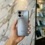 iQOO Z10 Turbo Plus Titanium Gray back panel held in hand inside mobile store