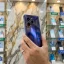 Realme GT 8 5G back panel held in hand in mobile store