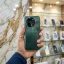 Redmi K80 Ultra Forest Green back panel held in hand inside mobile store